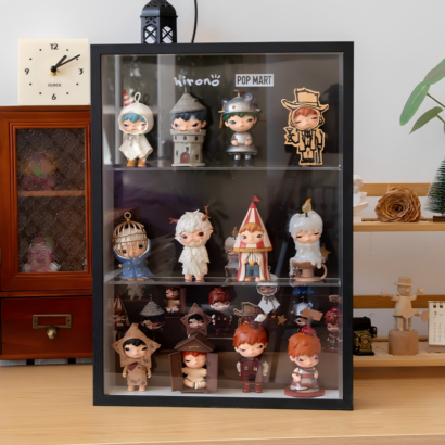 Black wooden frame shadow box display case with glass front housing dynamic Pop Mart Hirono collectible mini figures across multi-tier shelves