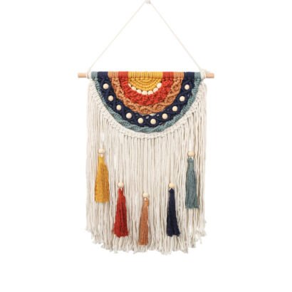 A handmade macrame wall hanging featuring a colorful rainbow arch design in yellow, red, brown, and dark blue with wooden beads, hanging fringe, and multicolored tassels suspended from a wooden stick