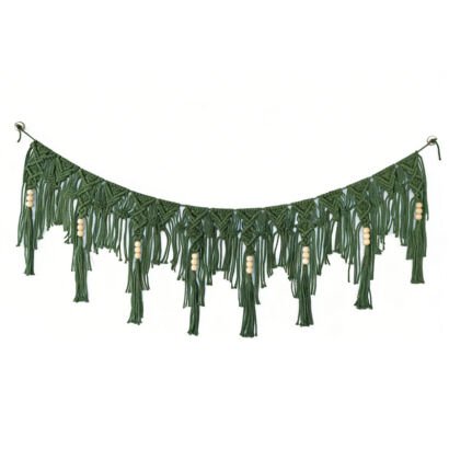 A green macrame garland hanging in a curved drape against a white background, featuring intricate woven knot patterns, cascading fringe, and natural wooden bead accents