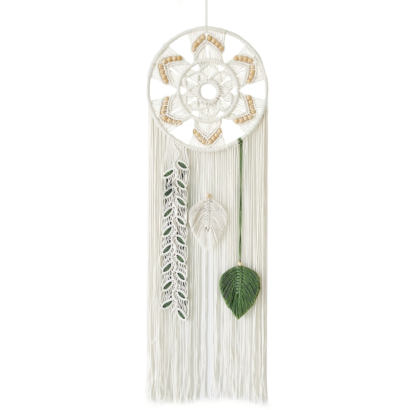 A handmade white macrame wall hanging featuring a circular woven ring accented with wooden beads, hanging fringe, and three distinct leaf-like pendants including a green leaf and a beaded strand