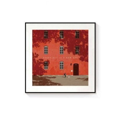 Framed square illustration of a vibrant red brick building facade shaded by autumn trees, featuring white multi-pane windows and a figure walking a dog in front with the text "EVERY DAY IS A NEW DAY"