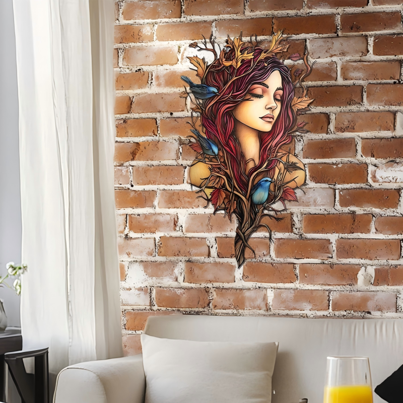 Forest goddess metal wall art, woman with red hair, antler branches and blue birds silhouette plaque mounted on exposed red brick wall