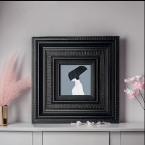 Multi-layer stepped black textured square picture frame with minimalist lady silhouette artwork, displayed on white sideboard with pink floral decor