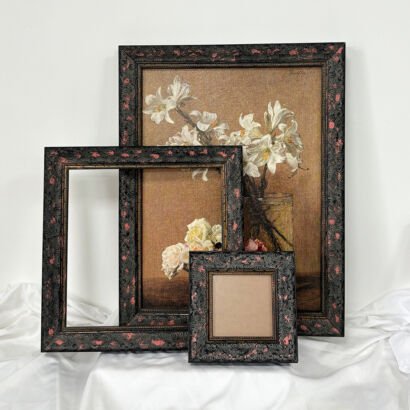 Vintage Distressed Black Photo Frames with Pink Floral Embossed Texture, Three Sizes Antique Picture Frames Displayed on White Fabric Surface