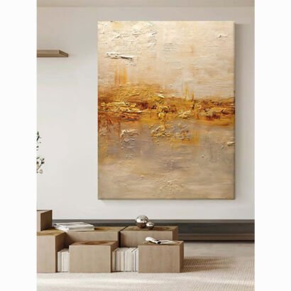 Square textured abstract landscape painting with golden impasto strokes, neutral beige and grey tones in modern room