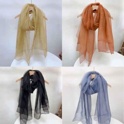 A four-panel grid showing lightweight, sheer solid-color scarves displayed on wooden hangers, available in light gold yellow, terracotta orange, classic black, and muted dust blue.