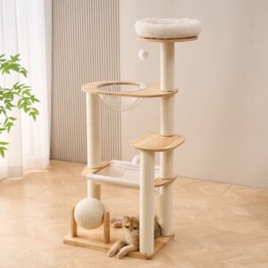 A multi-tier modern wooden cat tree featuring sisal-wrapped posts, a top plush round bed, a clear acrylic space capsule bowl, a cozy fabric hammock, a scratching ball at the base, and a golden British Shorthair cat lying on the floor underneath.