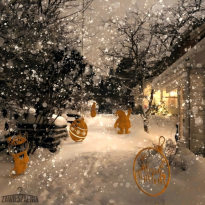 Rusty metal Christmas outdoor yard decor set, gnome, bauble, stocking and wreath silhouettes placed on snow-covered winter garden path with falling snow effect