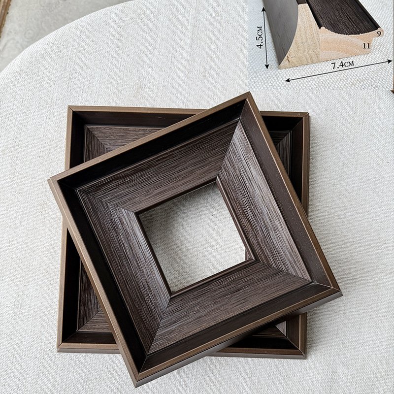 Dark brown wide bevel wooden picture frame blanks, square deep stepped wood moulding frames stacked on linen fabric with dimension diagram