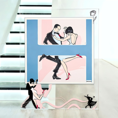 A large transparent acrylic art display frame standing near a staircase, featuring a central silk scarf illustration of dancing couples in black-tie attire against a blue and pink backdrop, with floating silhouette dancer motifs and a rose line sketch on the clear outer border.