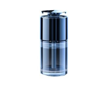 A modern black and clear glass cylindrical ultrasonic humidifier with a metallic top cap, designed for home office and bedroom desk use.