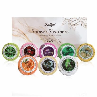 Assorted colorful round shower steamers with floral and herbal scent labels displayed in front of an elegant branded gift box.