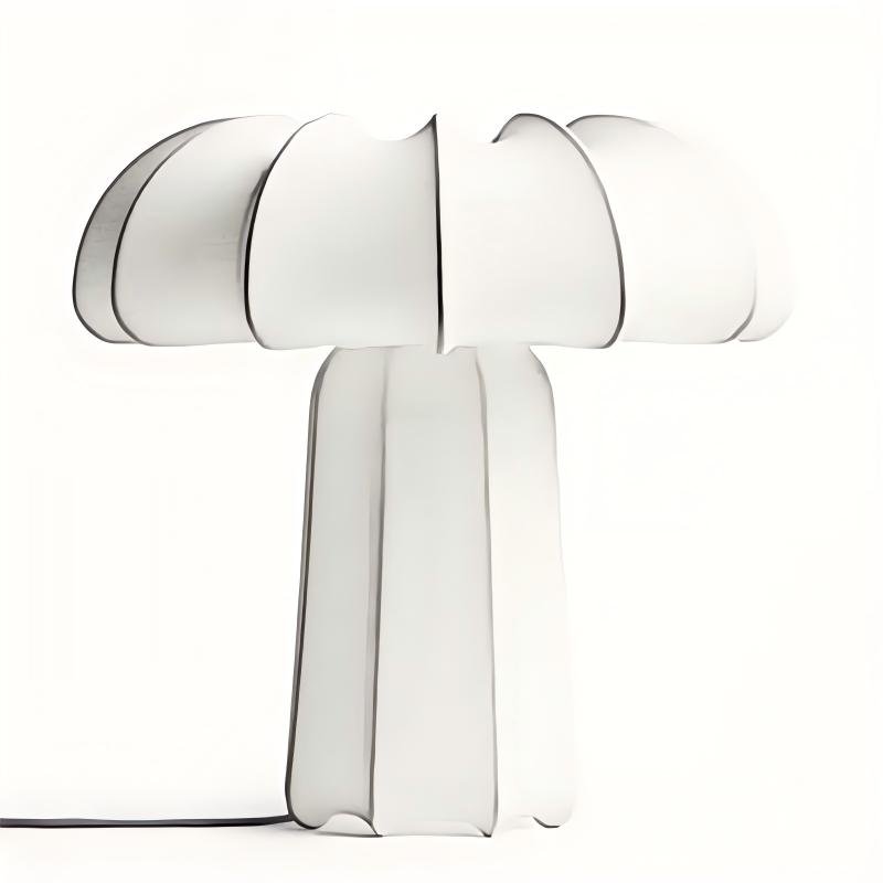A modern sculptural table lamp featuring a mushroom-shaped white translucent fabric shade and matching base with stitched dark seam edges, isolated on a white background