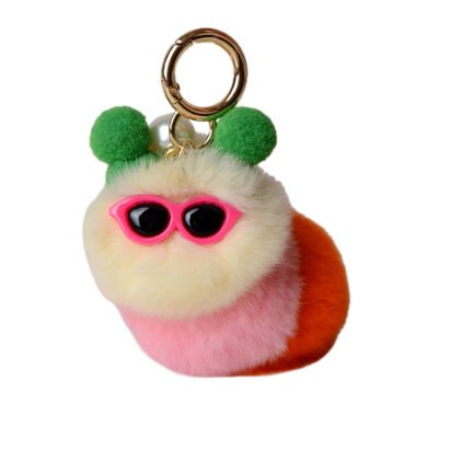 A vibrant plush caterpillar keychain made of yellow, pink, and orange fluffy faux-fur pom poms, wearing bright pink retro sunglasses and green pom pom ears with a gold keyring.