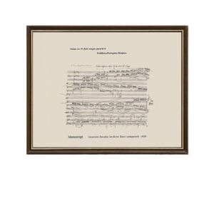 Framed vintage musical manuscript print of Chopin's Waltz in D-flat major Op. 64 No. 1 printed on beige parchment paper inside a dark wood frame