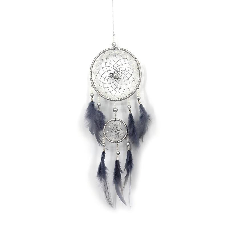 A detailed handmade dream catcher with two silver-wrapped hoops, intricate silver-beaded webs, and soft grey feathers hanging against a white background.
