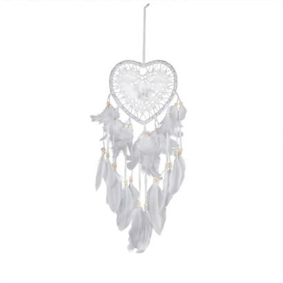 A detailed handmade white heart-shaped dream catcher with delicate lace-style webbing, wooden beads, and cascading white feathers against a plain background.