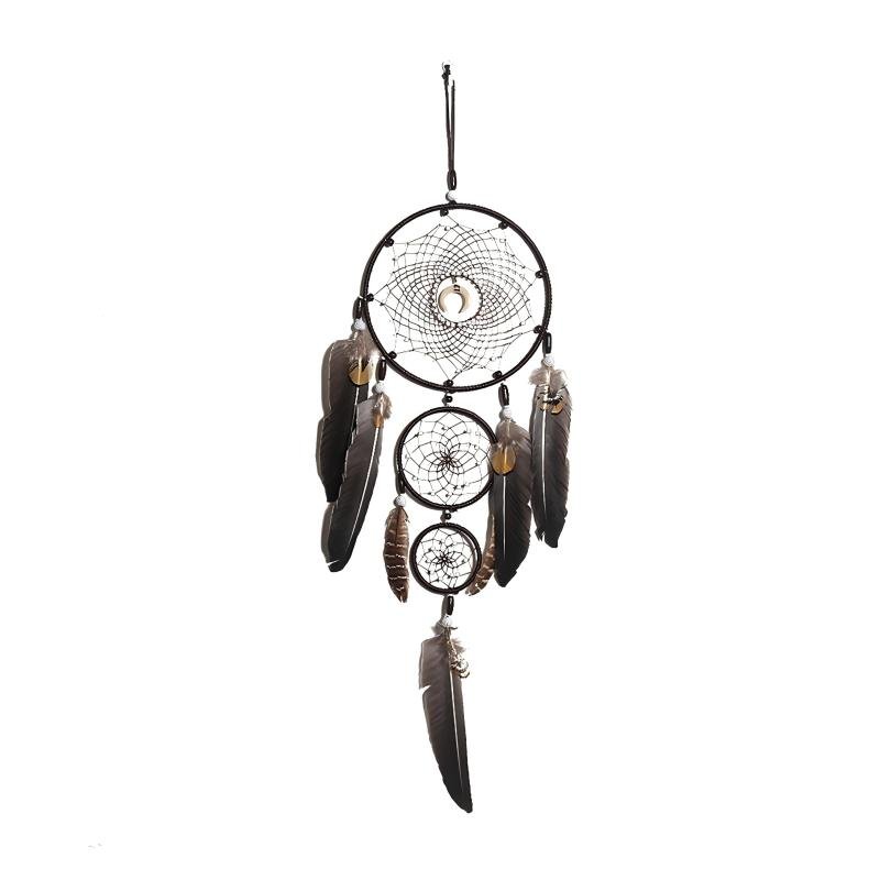A detailed handmade black dream catcher with three vertically connected hoops, a crescent moon pendant at the top web center, and dark brown feathers hanging against a plain background.