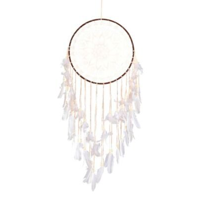 Handmade white dream catcher wall hanging with warm LED lights and cascading feathers.